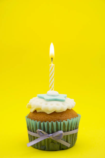 istock Cupcake decorated with white and blue cream. 1570433227