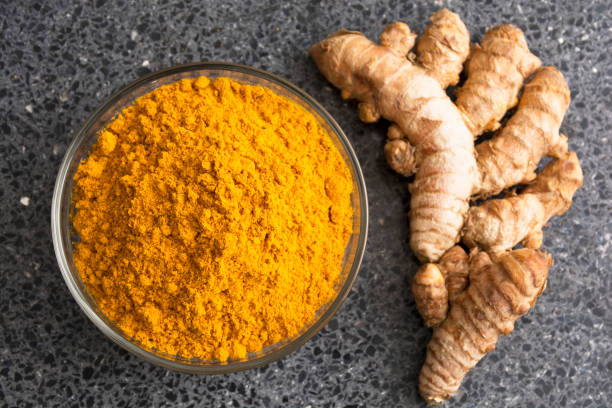 istock Fresh Turmeric Powder - Curcuma longa. 1570475755