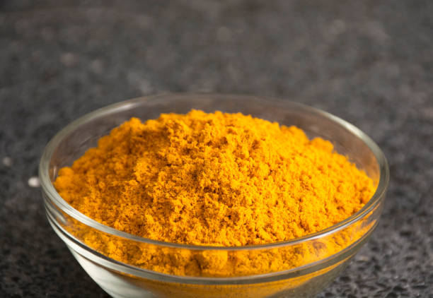 istock Fresh Turmeric Powder - Curcuma longa. 1570480928