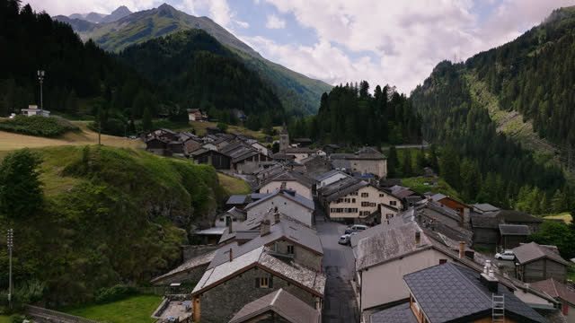 Drone Flight Over Rooftops in Swiss Mountain Town