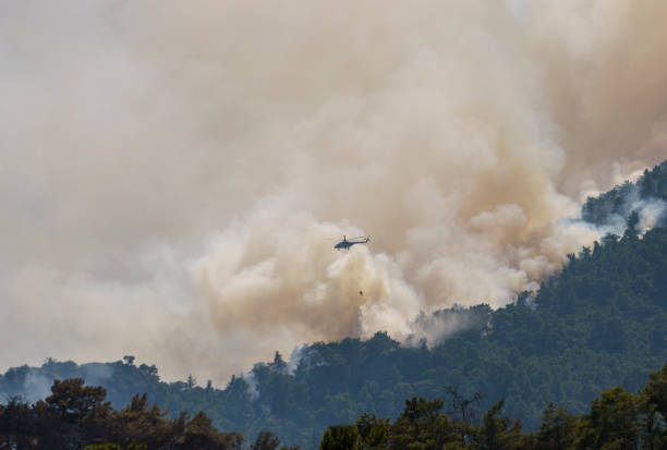 istock Firefighter Helicopter fighting against Kemer Forest Fire, Antalya, Turkiye 1570494580