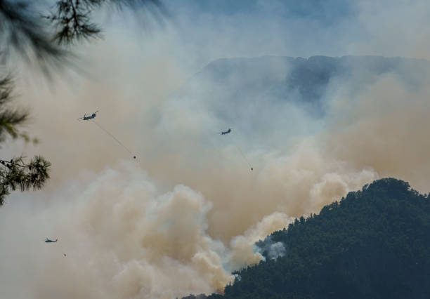 istock Firefighter Helicopter fighting against Kemer Forest Fire, Antalya, Turkiye 1570496218