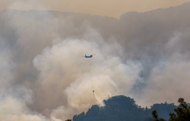 istock Firefighter Helicopter fighting against Kemer Forest Fire, Antalya, Turkiye 1570497817