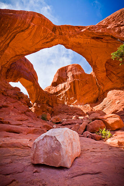 Double Arch Natural Geological Formation The sandstone arch located outside of Moab Utah, that is a popular tourist destination, known as "Double Arch" natural bridges national park photos stock pictures, royalty-free photos & images
