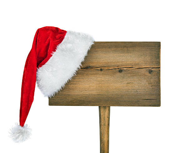 istock wooden road sign with Santa  hat 157050544