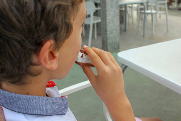 istock boy eating a delicious ice cream 1570526479