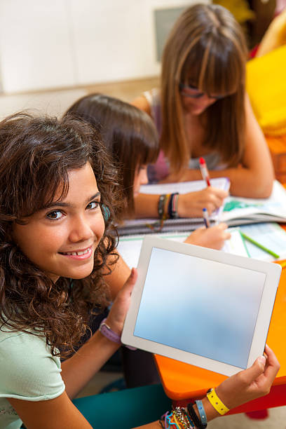 istock Young girl showing tablet with free copy space. 157056628