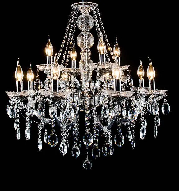 Contemporary glass chandelier isolated over black background