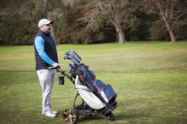istock Adult man playing golf in autumn 1570587534