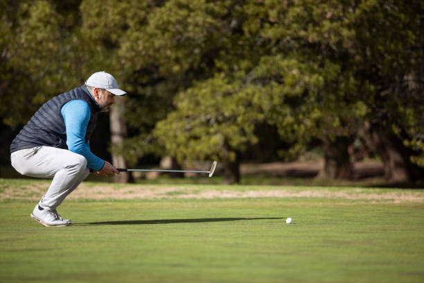 istock Adult man playing golf in autumn 1570590078