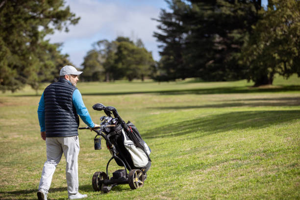 istock Adult man playing golf in autumn 1570591680