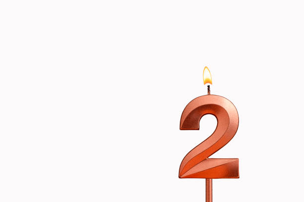 istock Birthday candle number 2 on white background 1570596101