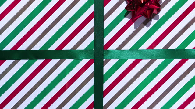 Stop motion of Opening the big, christmas present