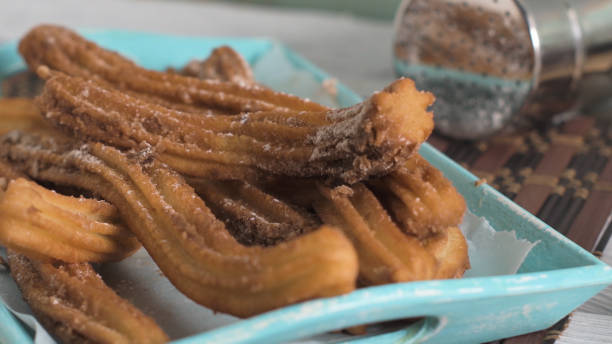 istock Traditional churros with hot chocolate 1570615118