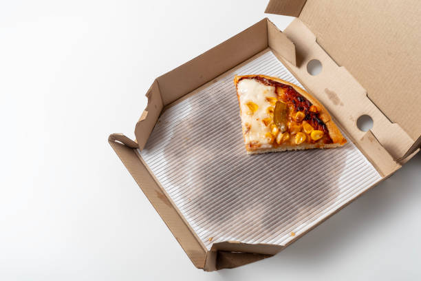 istock A slice of pizza in a cardboard box on a white background. top view, copy space. 1570629688