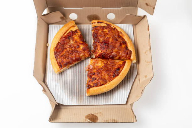 istock Margherita Pizza in a cardboard open delivery box on a white background. Top view. 1570638023
