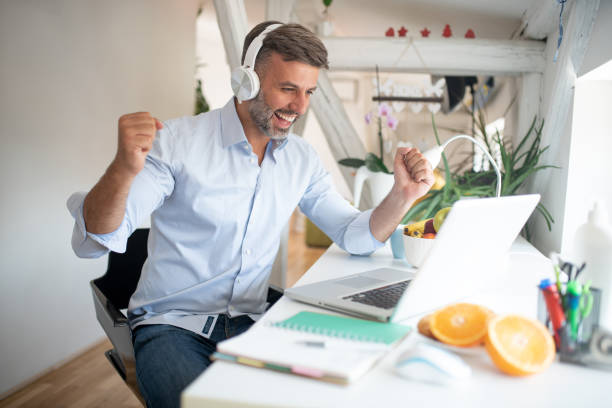 istock Mid adult man working from home 1570668949