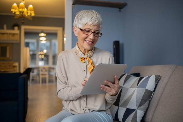 istock Portrait of a senior woman using digital tablet 1570672119