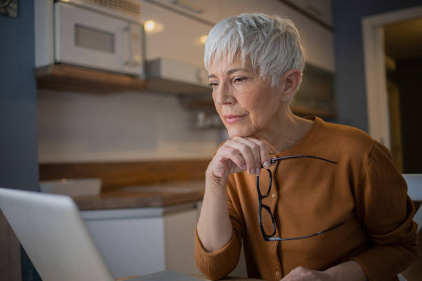 istock Senior woman working from home 1570672678