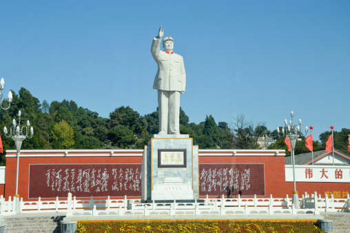 A statue of chairman Mao is still standing on a small square in Lijiang, China.