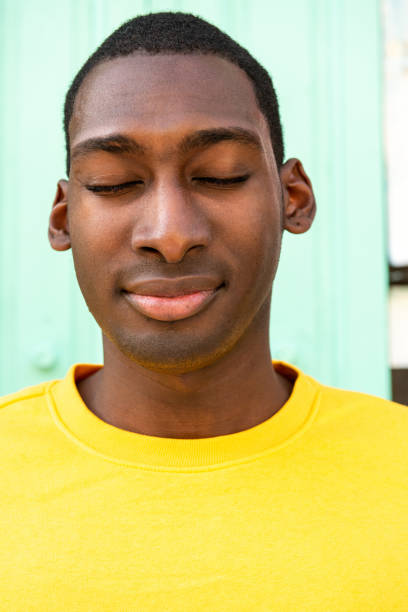 istock Close up young black man with eyes closed 1570688224