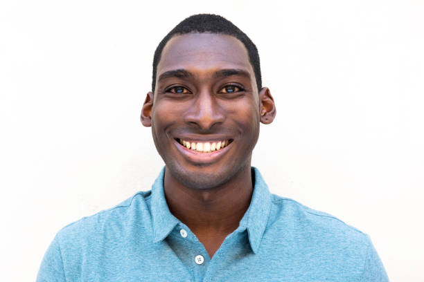 istock smiling young black man against isolated white background 1570688824