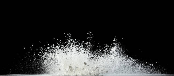 istock Tapioca starch flour fly explosion, White powder tapioca starch fall down in air. Seasoning flour powder is element material. Eyeshadow crush make up. Black background Isolated selective focus blur 1570689396