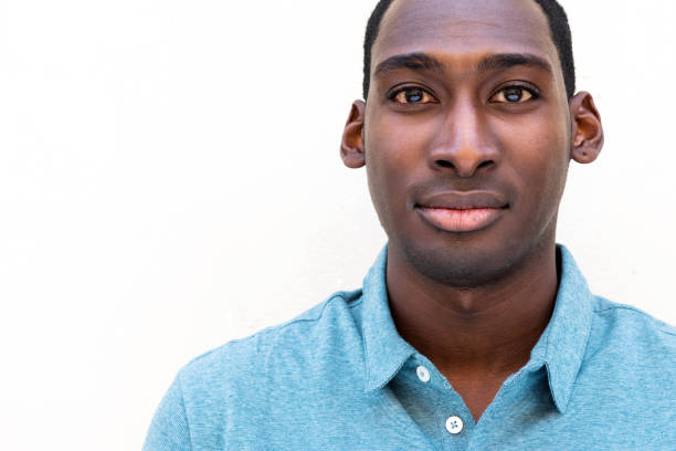 istock horizontal portrait young black man by isolated white background 1570689910