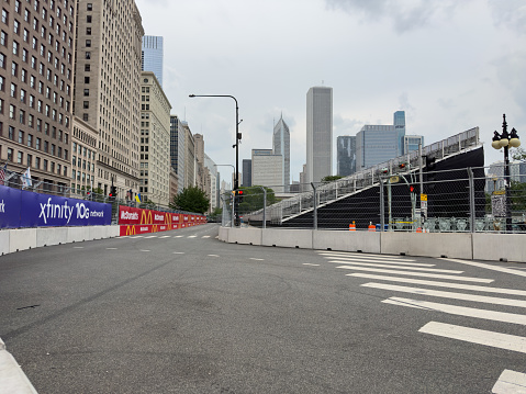 Michigan Avenue fenced off for street racing event with stands for a live audience.