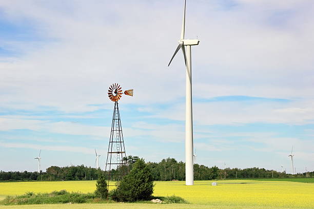 istock Traditional Windmill and Modern Wind Turbine Together 157070791