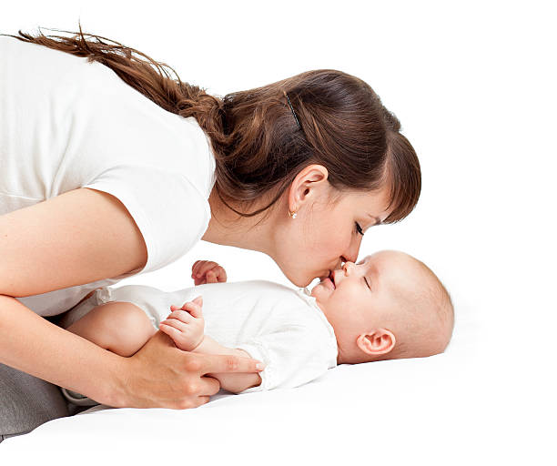 istock joyful mother playing with her baby infant 157070904