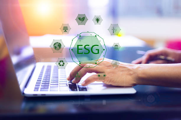 istock Businessman using laptop on virtual screen interface. Net zero, 2050,ESG concept. energy for green environment and energy icons around.Using AI (artificial intelligence) to help reduce global warming 1570716290