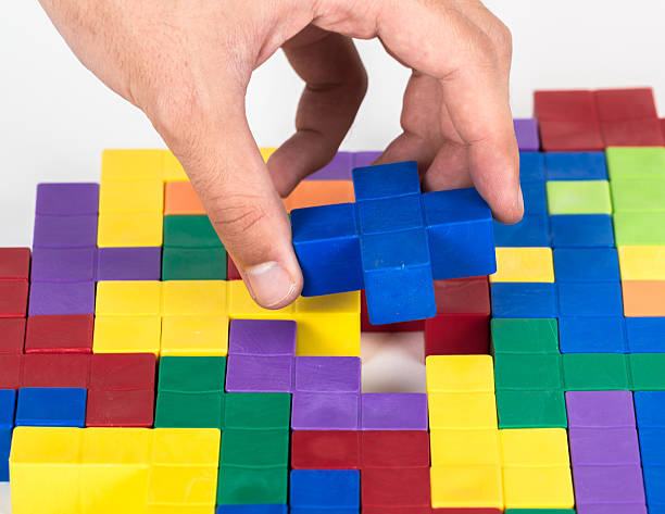 istock Completing the last piece of puzzle 157072084