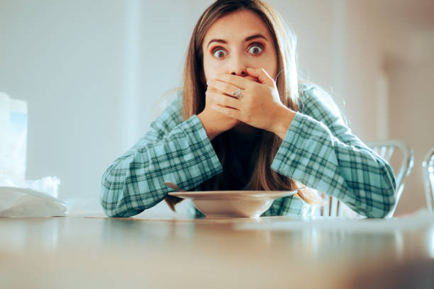 istock Woman Eating Breakfast Feeling Sick after 1570729476