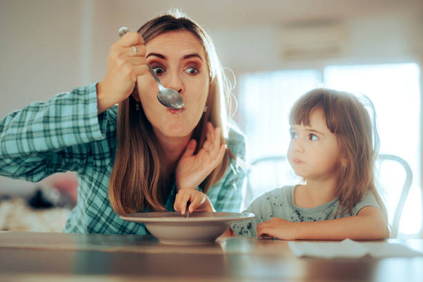 Beautiful blond hair girl having breackfast in the kitchen