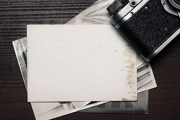 istock retro still camera and some old photos 157078159