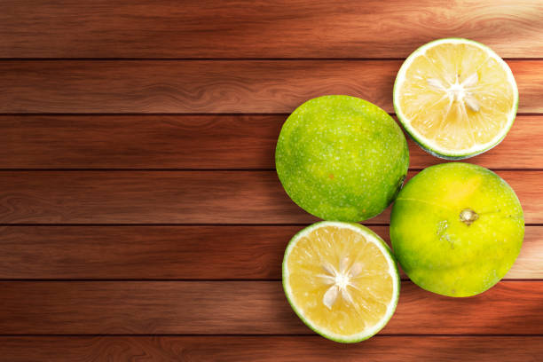 Lime on a wooden background. Top view