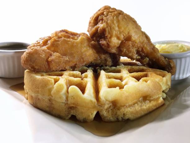 istock Chicken & Waffles with Maple Syrup and Butter in ramekins 1570853675