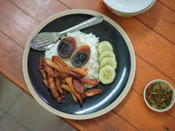 istock Deep-fried pork belly with fish sauce , preserved egg 1570862030