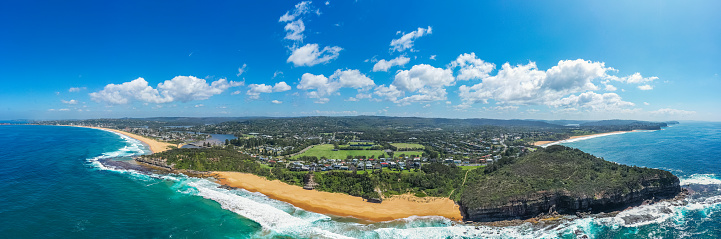 Aerial drone panoramic view of Warriewood in the Northern Beaches area, including view of the Narrabeen beach, Turimetta beach and Warriewood beach in Sydney, Australia