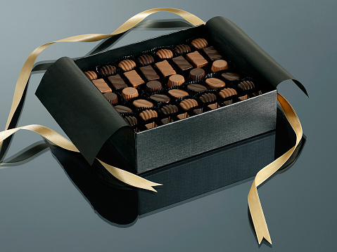 Box of gourmet gift truffles on a table top