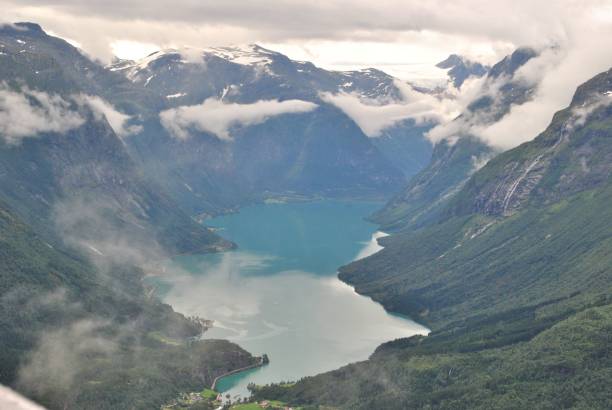 istock a lake in a valley surrounded by mountains on a cloudy day 1570975225