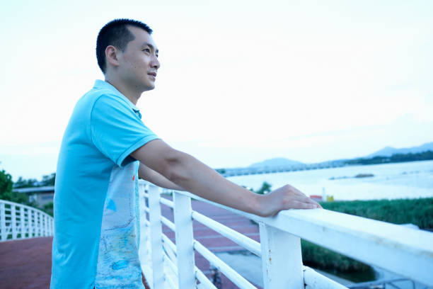 istock The man is looking at the view from the bridge 1570991480