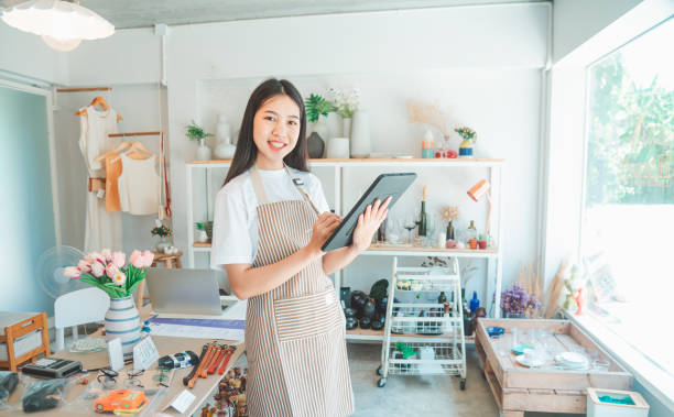 istock Small business owners are preparing a small shop and checking through a tablet and checking orders. 1571006145