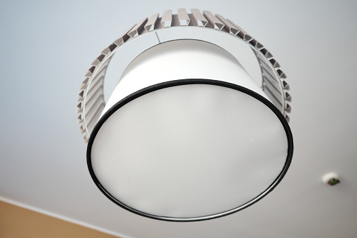 gray ceiling lamp hanging in a room