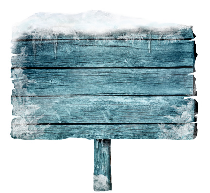 Wooden sign in winter with copyspace. Frozen wood sign with snow, ice and crystals. Space for your text.