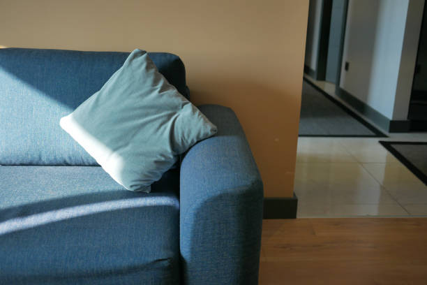 istock modern blue sofa with pillows in living room at home 1571058458