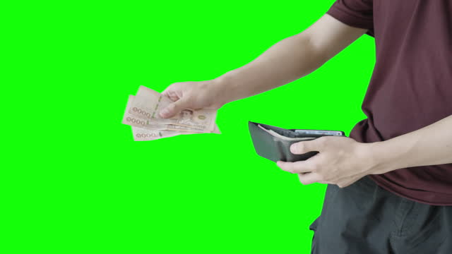 Man Take Money Out From Wallet and Giving to Someone on Green Screen