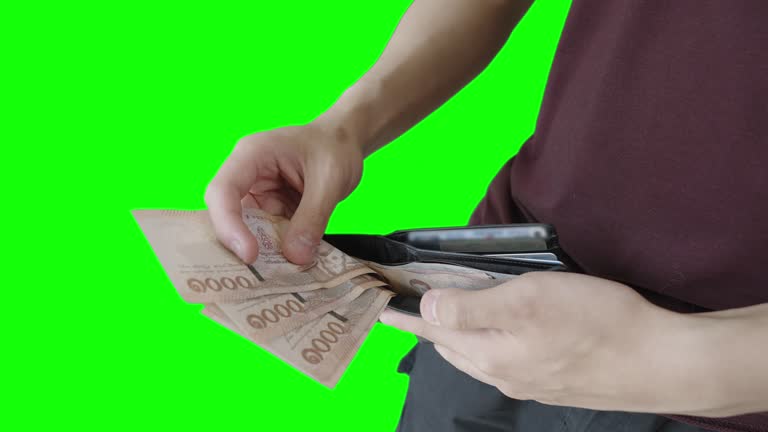 Man Take Money Out From Wallet to Counting And Calculating on Green Screen