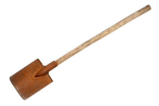 Shovel is isolated on a white background. An old rusty shovel with a wooden handle.